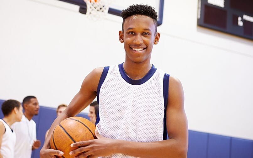 Young boy playing basketball